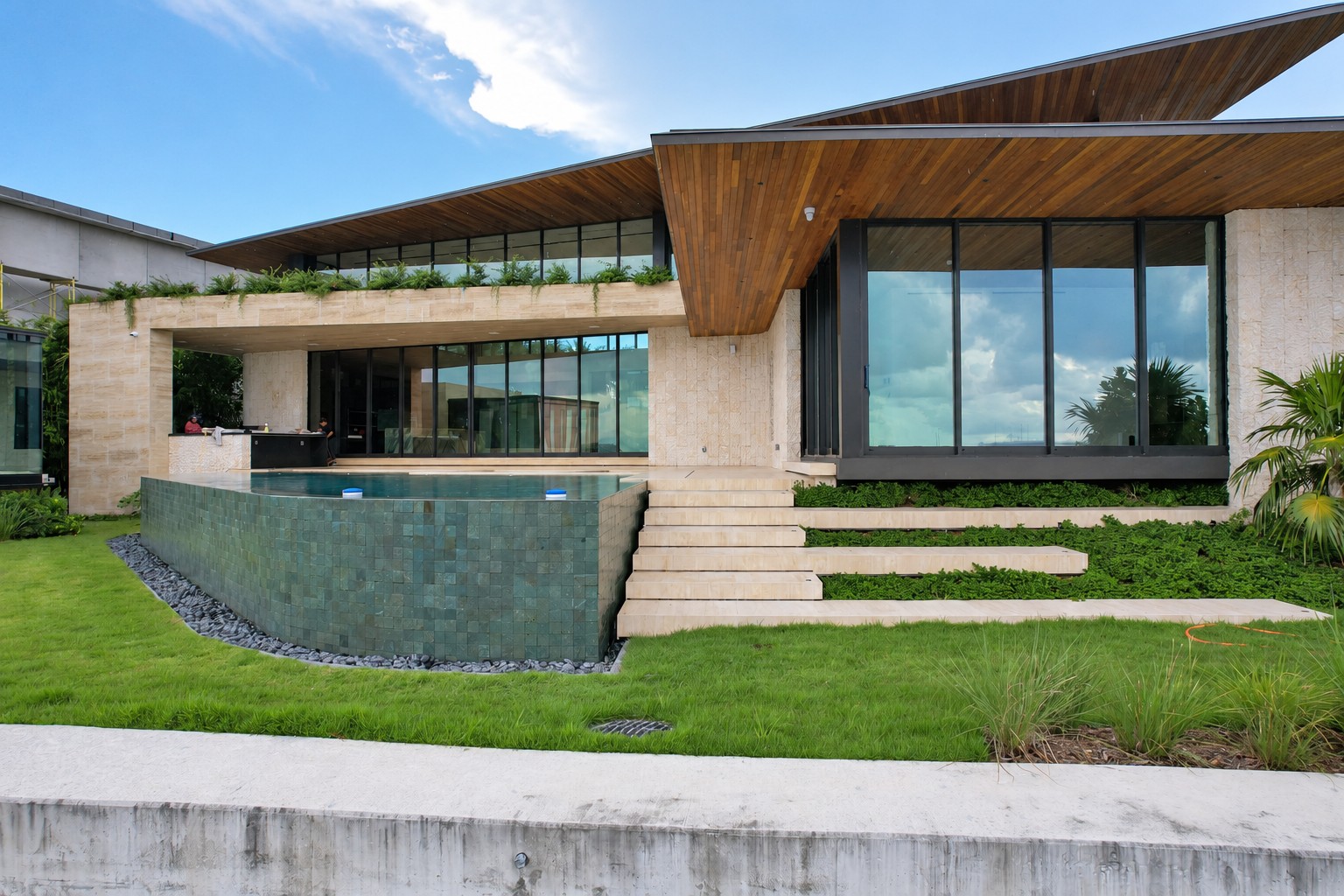 Modern waterfront house with a pool and terrace