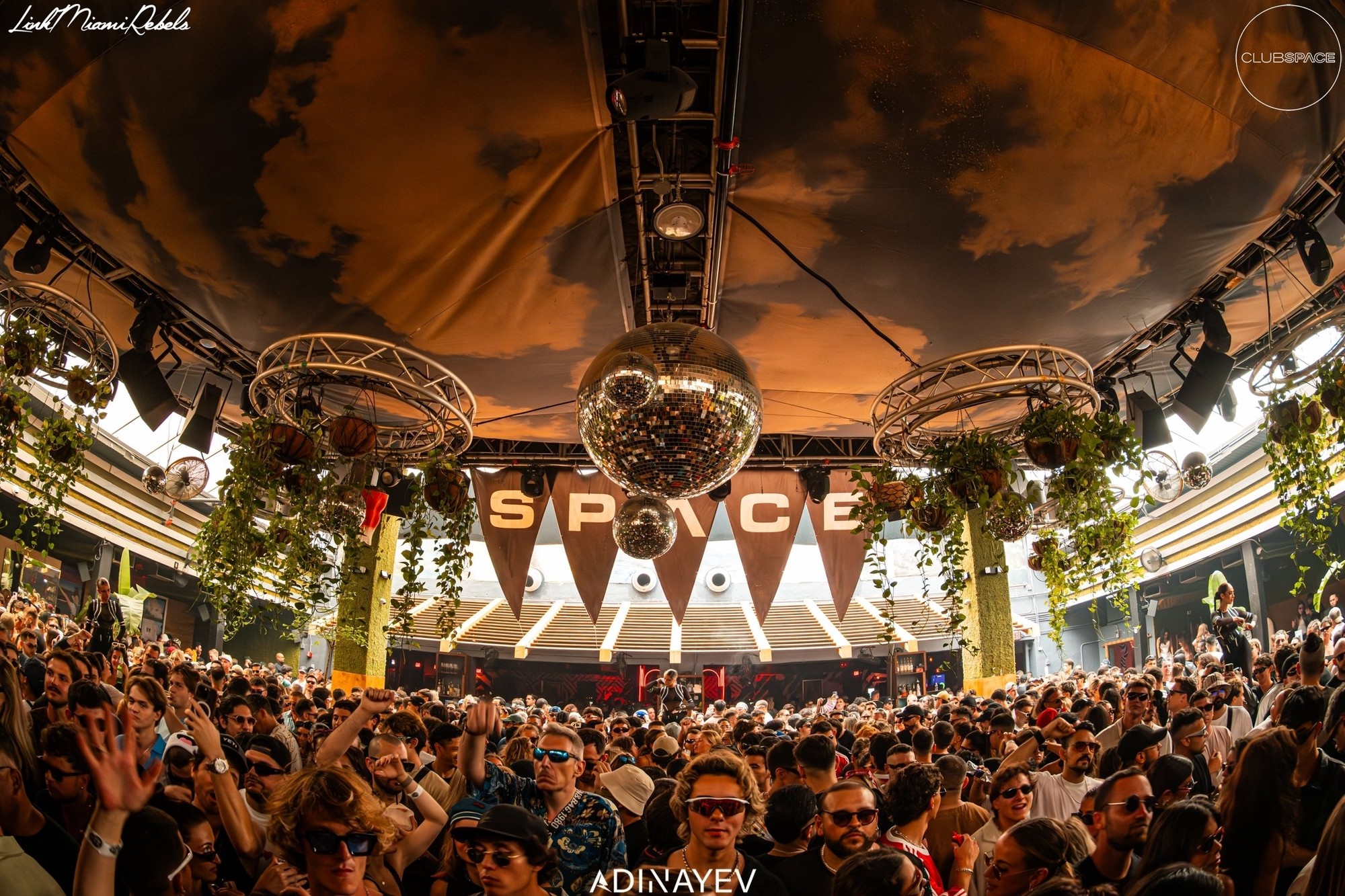 Crowd at a nightclub under a domed ceiling