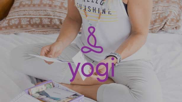 Yogi Surprise logo over a photo of a person reading
